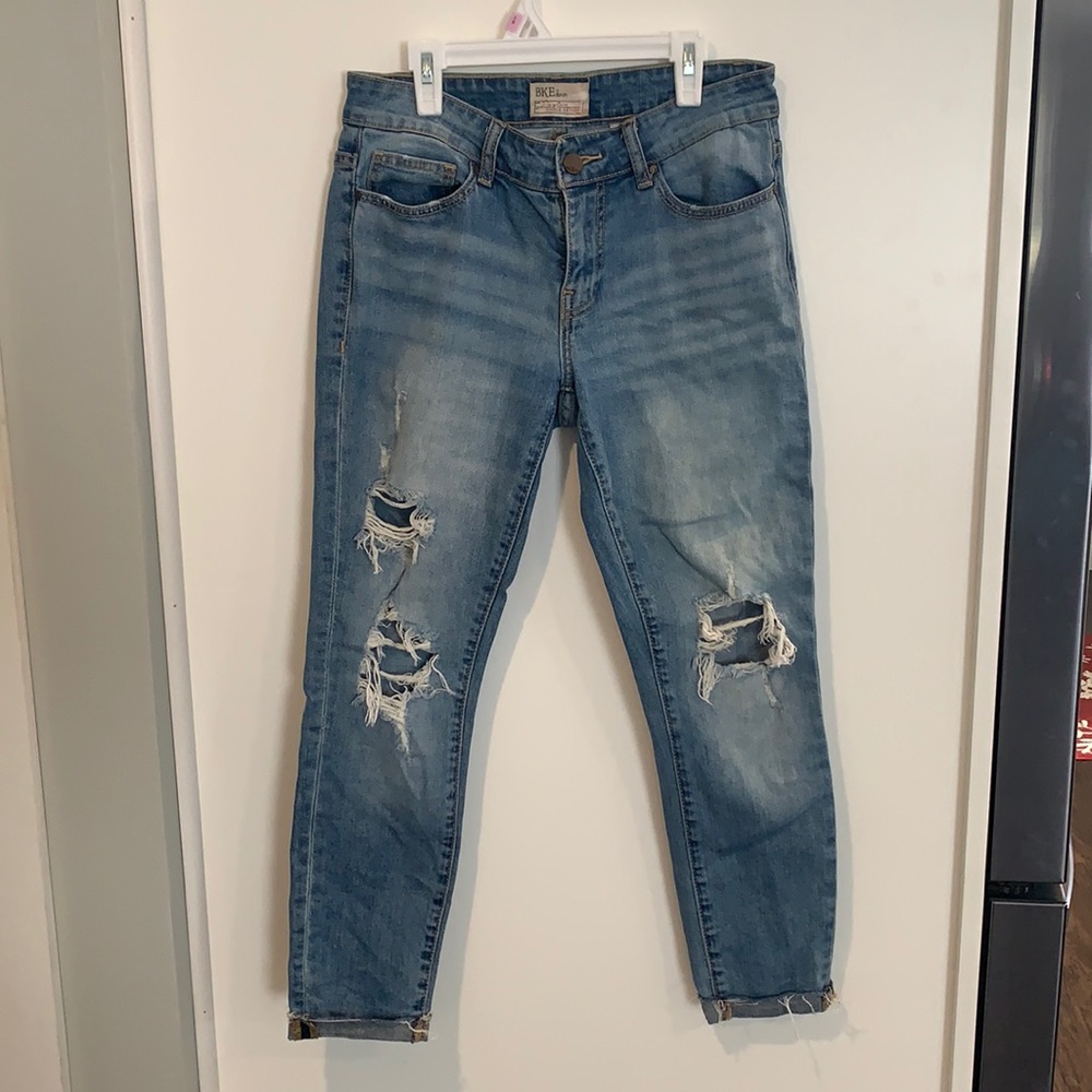 Buckle ankle skinny jeans
